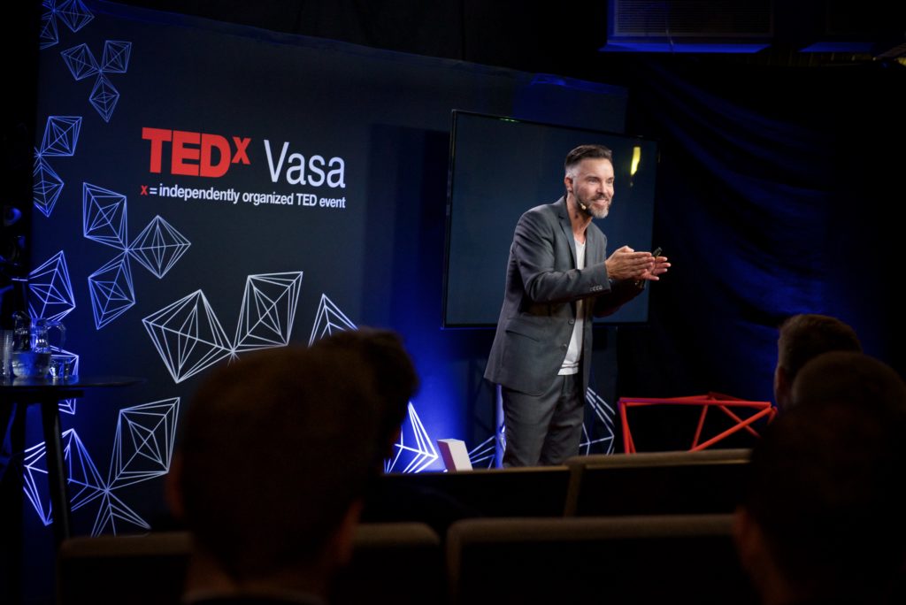 Full image of Antoni Lacinai at TEDx event in Vasa, Finland